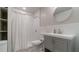 Bathroom featuring shower, toilet, vanity with modern faucet, and open storage with built in shelving at 4568 Mantova Dr, Buford, GA 30519