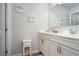 Bathroom with double sink vanity with white countertop and decorative elephant wall art at 4568 Mantova Dr, Buford, GA 30519