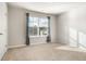 Well-lit bedroom with neutral carpet and a window with curtains and blinds at 4568 Mantova Dr, Buford, GA 30519