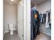 Walk-in closet with organized shelving and clothing racks, accessible from the bathroom at 4568 Mantova Dr, Buford, GA 30519