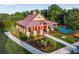 An eye-level outdoor view of the community clubhouse next to the community pool at 4568 Mantova Dr, Buford, GA 30519
