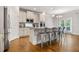 Modern kitchen with stainless steel appliances, granite countertops, and breakfast bar seating at 4568 Mantova Dr, Buford, GA 30519