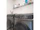 Modern laundry room featuring front load washer and dryer units at 4568 Mantova Dr, Buford, GA 30519