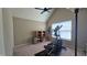 Bedroom with neutral colored walls, ceiling fan, and a large window for ample light at 1015 Pebble Creek Trl, Suwanee, GA 30024