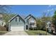 Charming two-story home featuring stone accents, vinyl siding and well-manicured lawn at 1015 Pebble Creek Trl, Suwanee, GA 30024