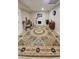 Basement living area with tile floors, ornamental fireplace, and large area rug at 1084 Whistle Dr, Austell, GA 30106