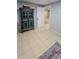 Finished basement area with tiled floor and accent furniture at 1084 Whistle Dr, Austell, GA 30106