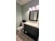 Well-lit bathroom with a stylish vanity, tiled floor, and neutral color palette at 1084 Whistle Dr, Austell, GA 30106