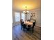 Cozy dining room with a chandelier, dining table, and large windows at 1084 Whistle Dr, Austell, GA 30106