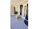 Inviting front porch with seating, decorative plants, and a view of the entryway at 1084 Whistle Dr, Austell, GA 30106