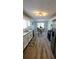 Modern kitchen with white cabinets, granite countertops, stainless steel appliances, leading to dining room at 1084 Whistle Dr, Austell, GA 30106