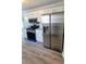 Bright kitchen features stainless steel refrigerator, gas range, granite countertops, and white cabinets at 1084 Whistle Dr, Austell, GA 30106