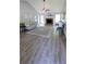 Bright living room with fireplace, vaulted ceiling, hardwood floors, and neutral decor at 1084 Whistle Dr, Austell, GA 30106