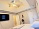 Bedroom featuring a ceiling fan, a TV, ample natural light, and carpeted floors at 128 Brookhaven Ln, Mcdonough, GA 30253