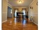 Cozy dining area featuring gleaming hardwood floors and natural light at 128 Brookhaven Ln, Mcdonough, GA 30253