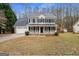 Charming two-story home with a welcoming front porch and attached two-car garage at 128 Brookhaven Ln, Mcdonough, GA 30253