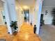 Hallway with hardwood floors connecting various rooms at 128 Brookhaven Ln, Mcdonough, GA 30253