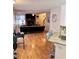Bright living room showcasing hardwood floors, fireplace, and view of staircase at 128 Brookhaven Ln, Mcdonough, GA 30253