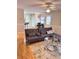 Comfortable living room with modern furnishings and neutral color scheme at 128 Brookhaven Ln, Mcdonough, GA 30253