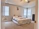 Spacious main bedroom features plush carpet, tray ceiling, and ample natural light at 128 Brookhaven Ln, Mcdonough, GA 30253