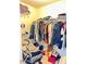 Walk-in closet with shelving, hanging clothes, and storage space at 128 Brookhaven Ln, Mcdonough, GA 30253