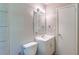 Bathroom featuring a toilet, sink, and a bright ceiling light at 4684 City View Dr, Forest Park, GA 30297