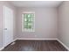 Simple bedroom design with durable laminate flooring, fresh paint, and natural light at 4684 City View Dr, Forest Park, GA 30297