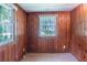 Cozy room with wooden paneled walls and natural light from the window at 4684 City View Dr, Forest Park, GA 30297