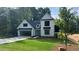 Beautifully designed two-story home with modern curb appeal and an attached two car garage at 500 Level Creek Rd, Sugar Hill, GA 30518