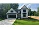 Charming two-story home with a well-maintained lawn and attached two car garage at 500 Level Creek Rd, Sugar Hill, GA 30518