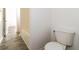 Bright bathroom featuring tile floors, a toilet, and a bathtub at 5880 Trent Walk Dr, Lithonia, GA 30038