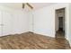 Bedroom featuring modern floors, fresh paint, and closet for ample storage at 5880 Trent Walk Dr, Lithonia, GA 30038