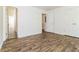 Bedroom featuring modern floors, fresh paint, and closet for ample storage at 5880 Trent Walk Dr, Lithonia, GA 30038