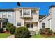 Charming multi-level home with a cozy front porch and manicured landscaping at 5880 Trent Walk Dr, Lithonia, GA 30038
