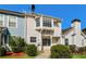 Charming multi-level home with a cozy front porch and manicured landscaping at 5880 Trent Walk Dr, Lithonia, GA 30038