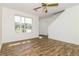 Bright living room with wood flooring, ceiling fan, and staircase at 5880 Trent Walk Dr, Lithonia, GA 30038