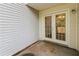 Covered outdoor patio area with door and siding at 5880 Trent Walk Dr, Lithonia, GA 30038