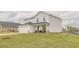 Charming two-story home features a well-manicured lawn, two-car garage and welcoming front porch with rocking chairs at 88 Oxford Ln, Kingston, GA 30145