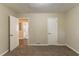 Neutral bedroom with carpet, connecting to a bathroom and featuring a white door at 2304 Ousley Ct, Decatur, GA 30032