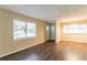 Well-lit living room featuring hardwood floors, neutral paint, and ample sunlight through large windows at 2304 Ousley Ct, Decatur, GA 30032