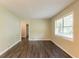 Spacious living area with hardwood flooring and large window that floods the room with natural light at 2304 Ousley Ct, Decatur, GA 30032