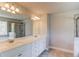 Bathroom with a double sink vanity, a large mirror, and a separate shower at 2378 Morgan Creek Rd, Buford, GA 30519