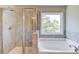 Bathroom showcasing a shower and soaking tub at 2378 Morgan Creek Rd, Buford, GA 30519