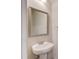 Powder room featuring a pedestal sink and a framed mirror at 2378 Morgan Creek Rd, Buford, GA 30519