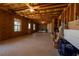 Large, unfinished basement with exposed beams and insulation, offering ample space at 3482 Willow Meadow Ln, Douglasville, GA 30135