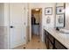 Elegant bathroom featuring dual sinks, modern vanity, and access to a spacious walk-in closet at 3482 Willow Meadow Ln, Douglasville, GA 30135