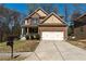 Charming two-story home with a well-manicured lawn and attached two-car garage at 3482 Willow Meadow Ln, Douglasville, GA 30135