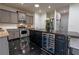 Elegant kitchen island with wine cooler, granite countertops and stainless steel appliances at 3482 Willow Meadow Ln, Douglasville, GA 30135