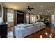Open-concept living room features a fireplace, flat-screen TV, and plush gray sofa, perfect for relaxing and entertaining at 3482 Willow Meadow Ln, Douglasville, GA 30135