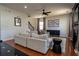 Bright living room with hardwood floors, neutral furniture, and a cozy fireplace at 3482 Willow Meadow Ln, Douglasville, GA 30135